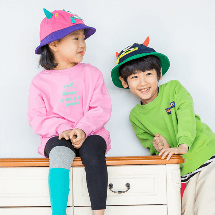 Image of Models wearing Devil Wing Bucket Hats. The fisherman hat is made more fashionable and lovely by using the cute 3D cartoon shape, it is is both fun and functional.